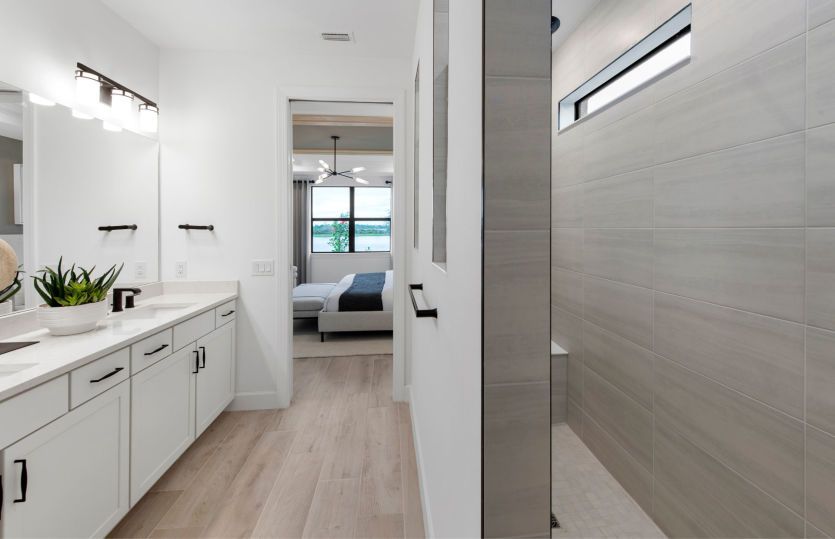 Owner's bathroom with double sink vanity & walk in shower