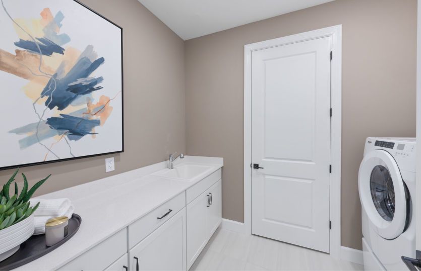 Laundry room with additional storage