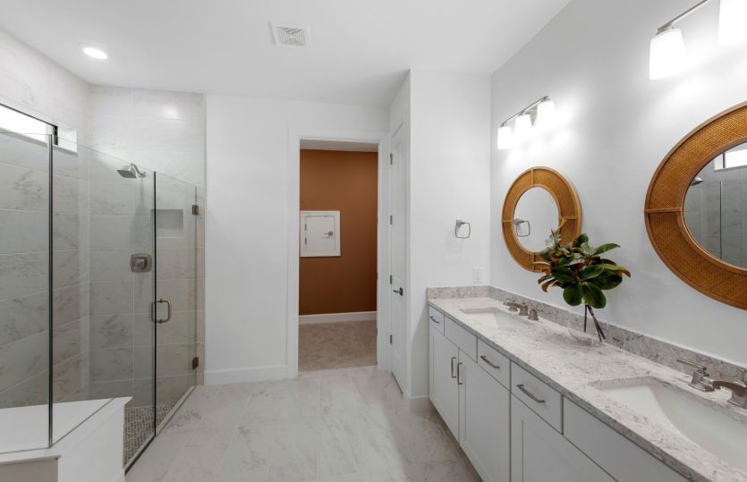 Owner's bathroom with dual sink vanity & large shower