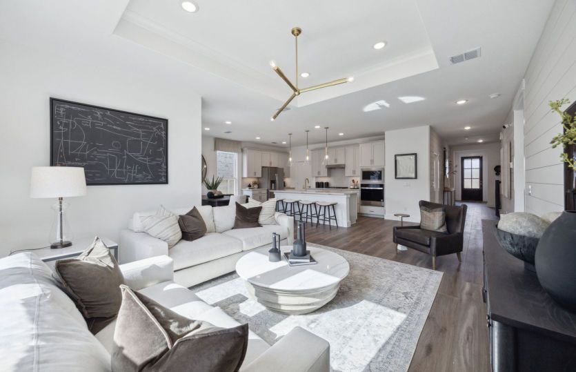 Spacious gathering room with view of main living areas *model representation