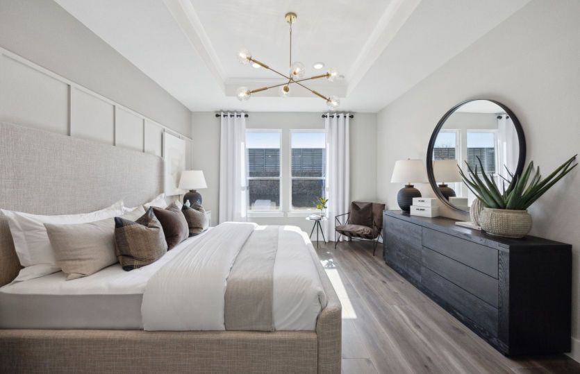 Primary suite with large windows *model representation