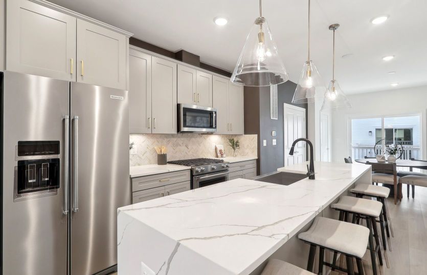 Kitchen Features Stainless Steel Appliances and Plenty of Countertop Space