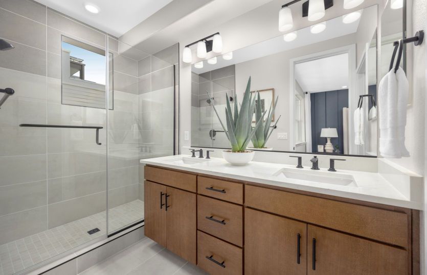 Owner's bathroom with double vanities and walk-in shower