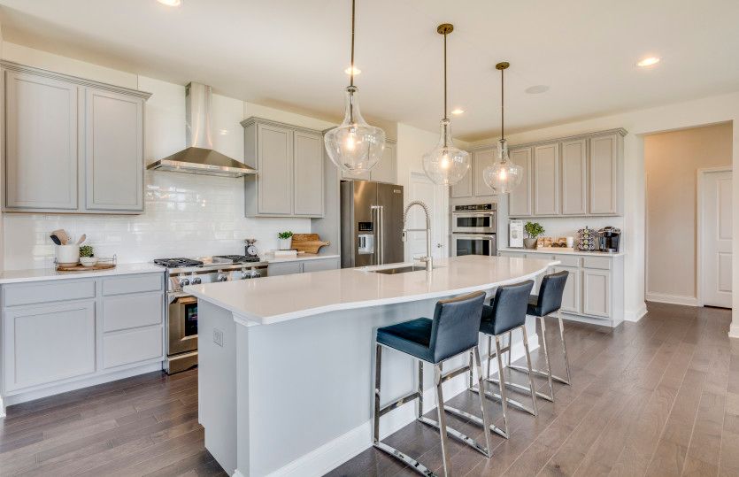 Gourmet Kitchen with Stylish Gray Cabinets and Crown Molding