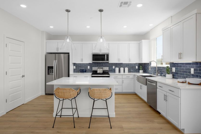Gorgeous kitchen overlooks the gathering room