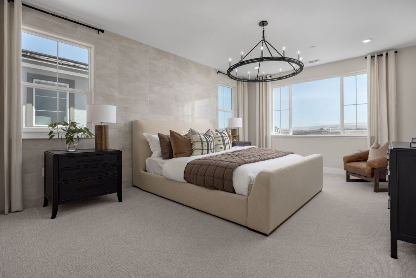 Owner's suite bedroom with large windows