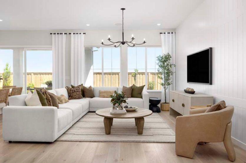 Open-concept gathering room with plenty of sunlight