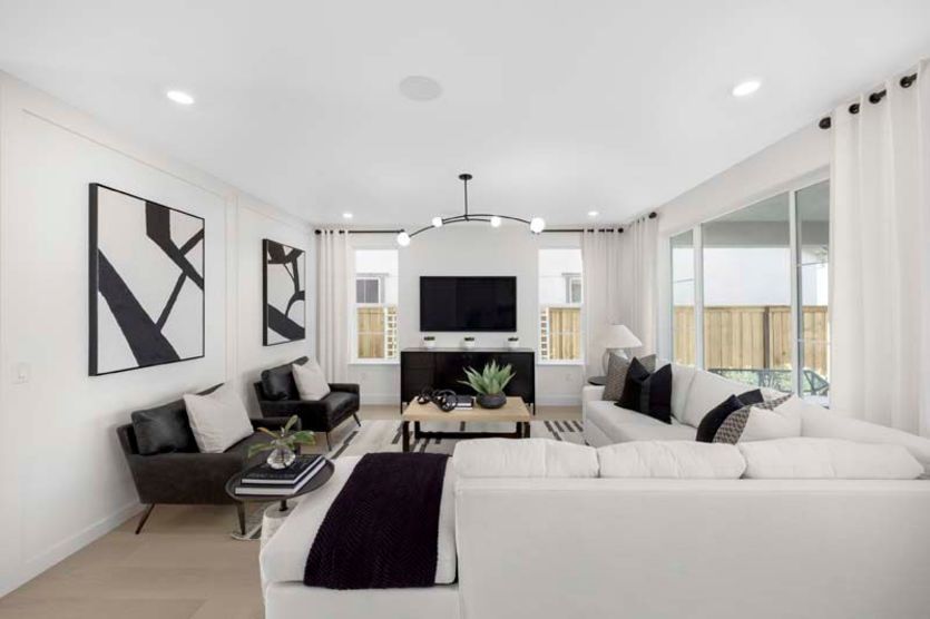 Gathering room with sliding glass doors to patio