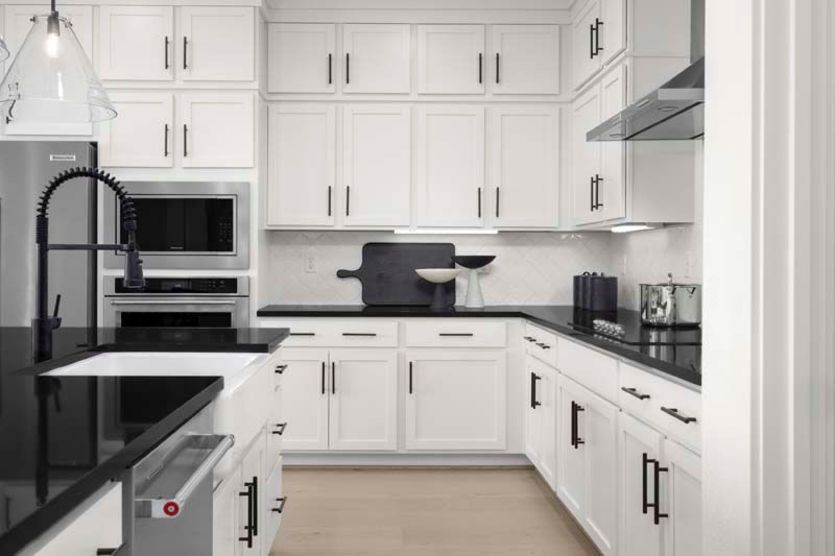 Impressive kitchen with stacked cabinets and ample storage