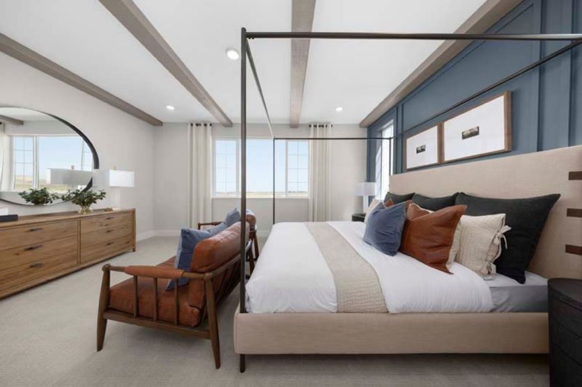 Owner's suite with tall ceilings and natural light