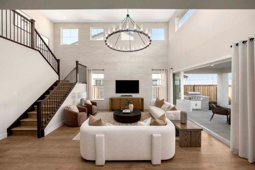 Gathering room with sliding glass doors to covered patio