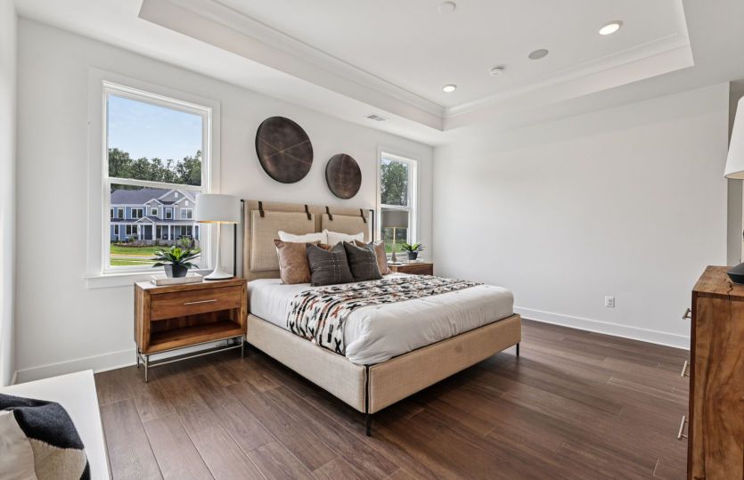 Elegant Owner's Suite with a Private Bathroom and Two Walk-in Closets