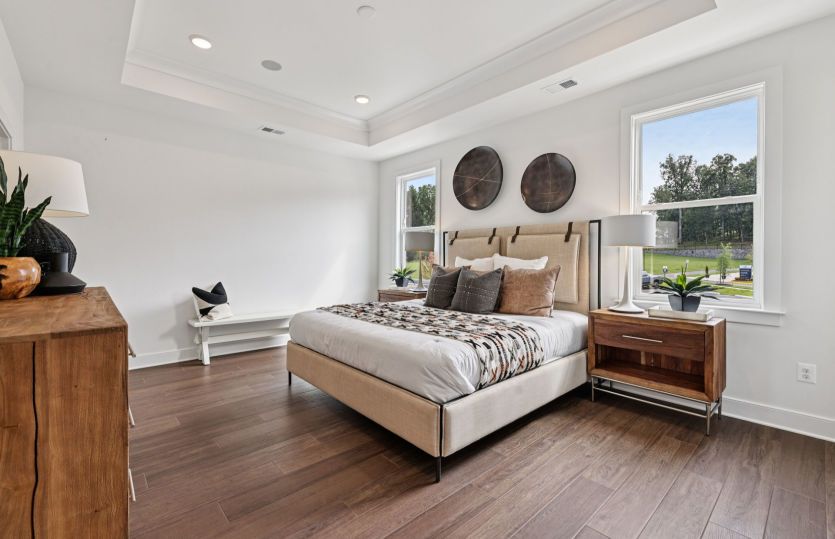 Elegant Owner's Suite with a Private Bathroom and Two Walk-in Closets