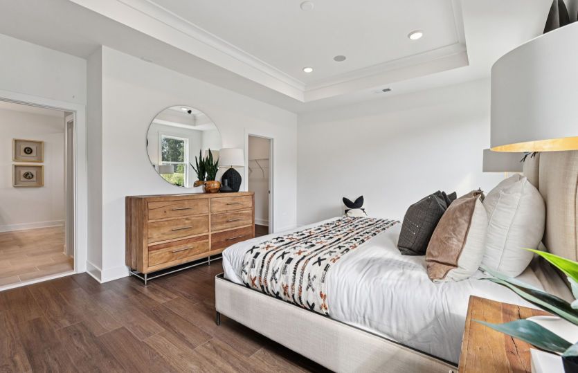 Elegant Owner's Suite with a Private Bathroom and Two Walk-in Closets