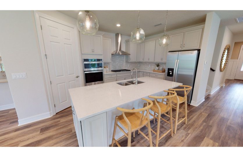 Kitchen with Stainless Steel Hood Vent