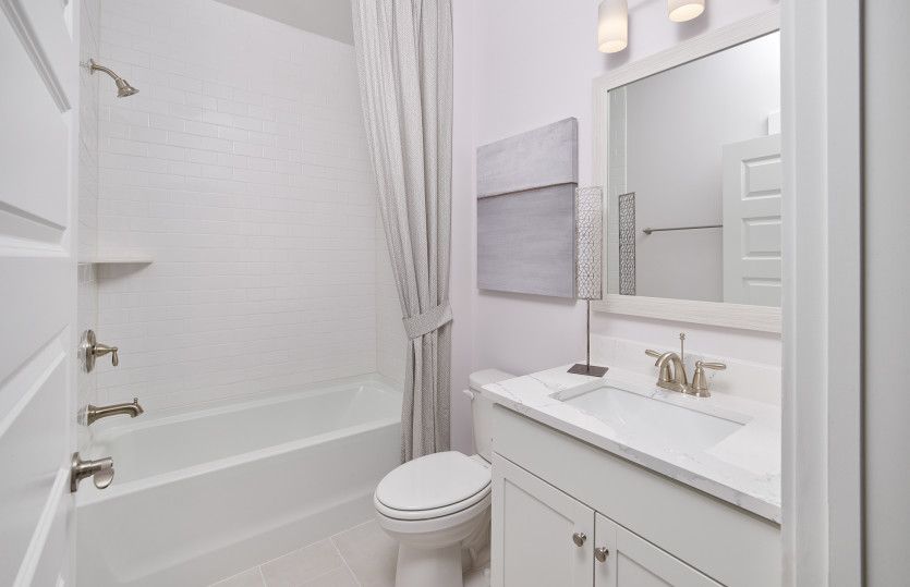 Additional bright white bath with a soaking tub.