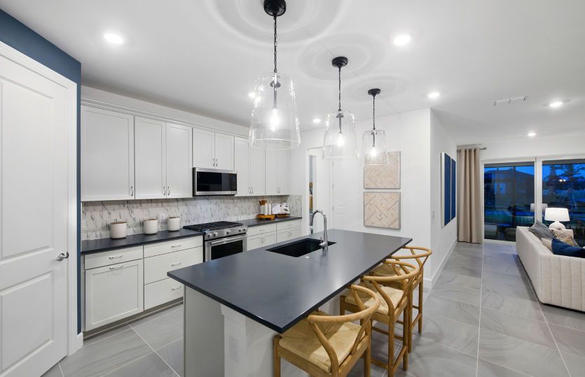 The Kitchen with center island and stainless steel appliances