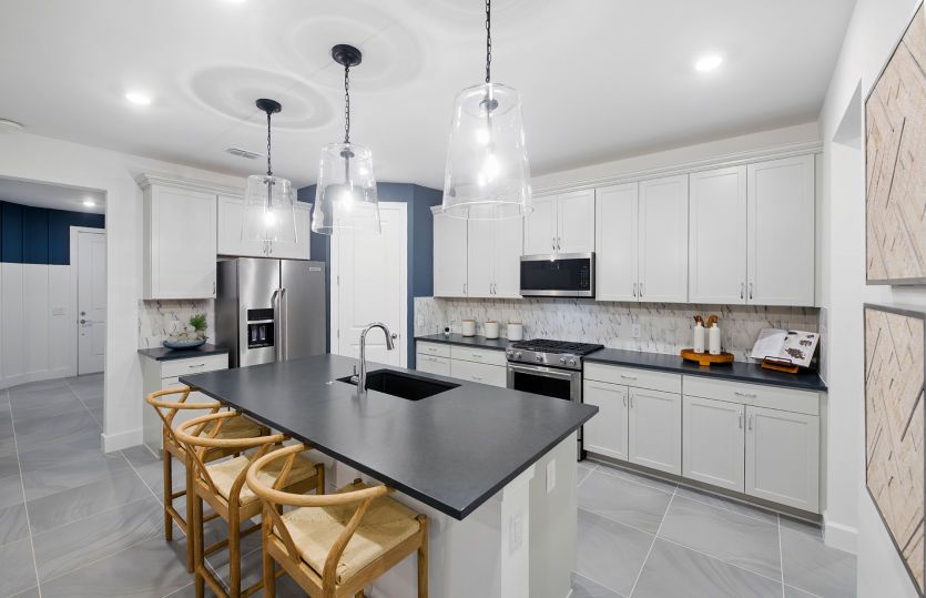 Open kitchen with center island and walk-in pantry