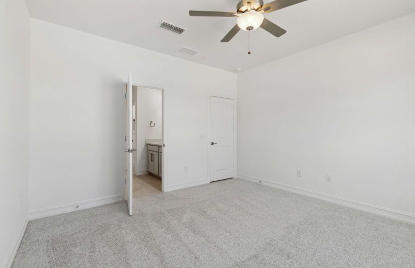 Elegant owner's suite with large windows and private bathroom