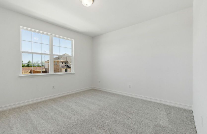 Spacious owner's suite with expansive windows