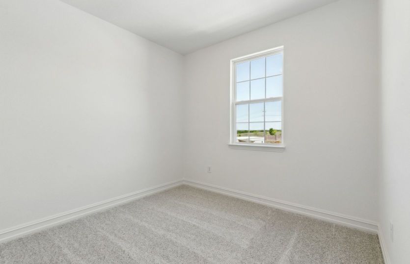 Spacious secondary bedroom with large windows