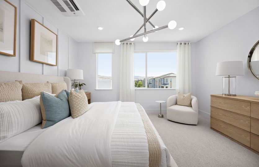 Owner's suite with large windows and walk-in closet