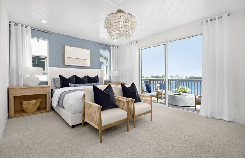 Owner's suite with balcony access and lake views