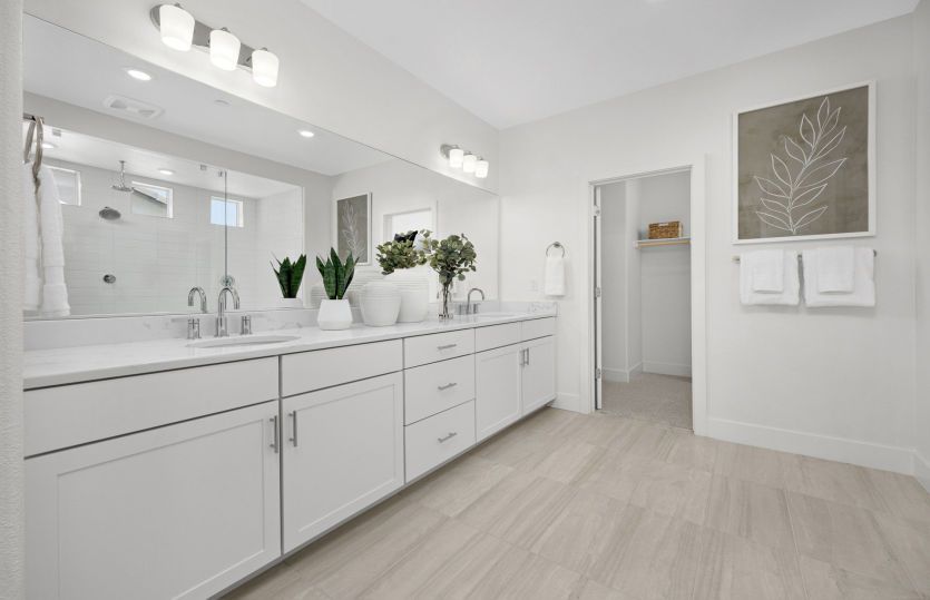 Owner's suite bathroom with dual vanities