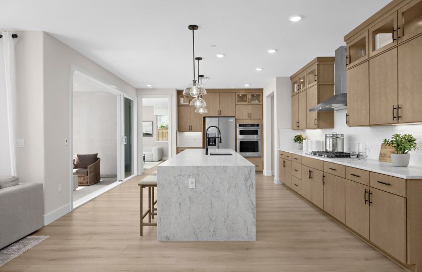 Kitchen with large waterfall edge island
