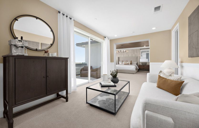Owner's suite sitting area with balcony access