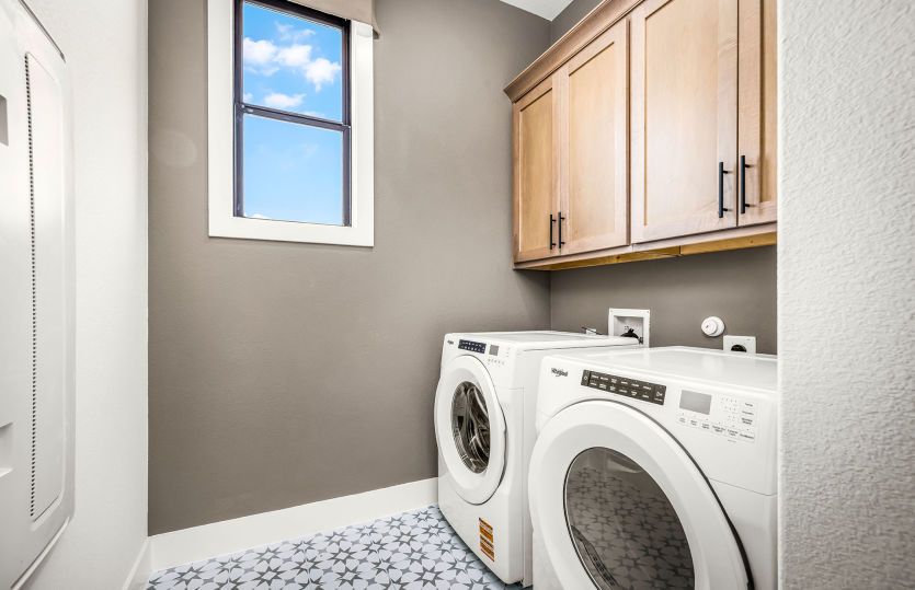 Spacious Laundry Room with Cabinet Storage