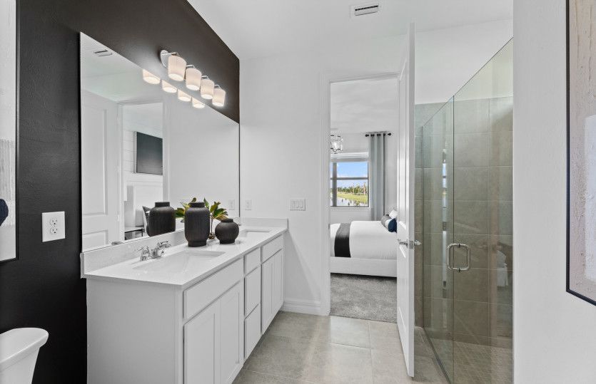 Relaxing owner's bathroom with oversized shower with glass enclosure