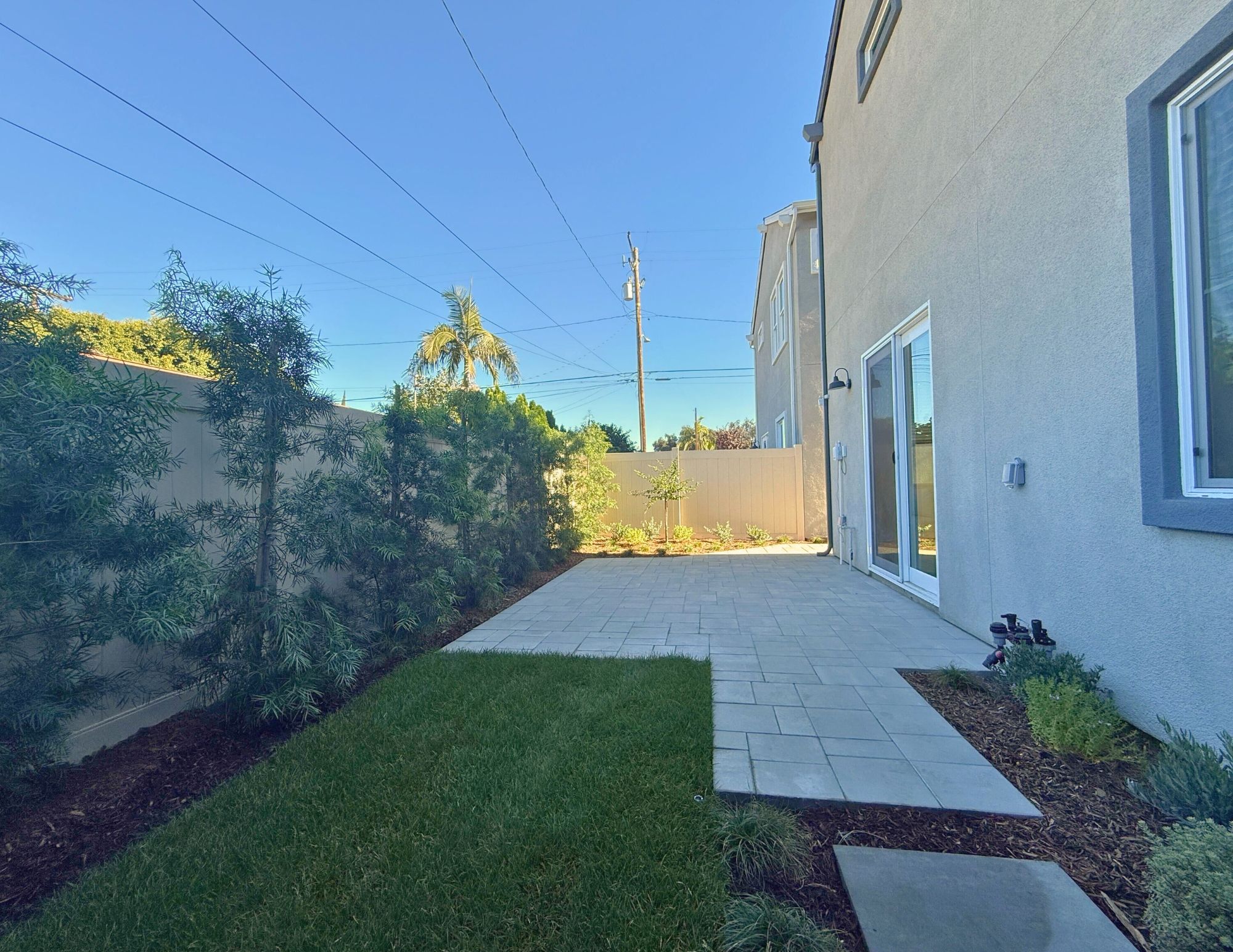 Upgraded spacious outdoor patio with vinyl fencing