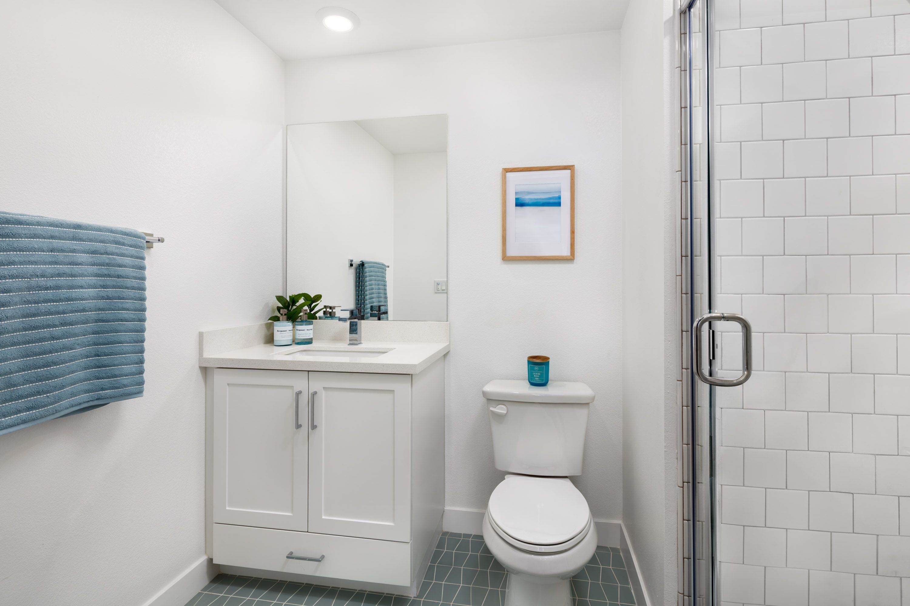 Model home convenient first-floor full bathroom with vanity and shower.