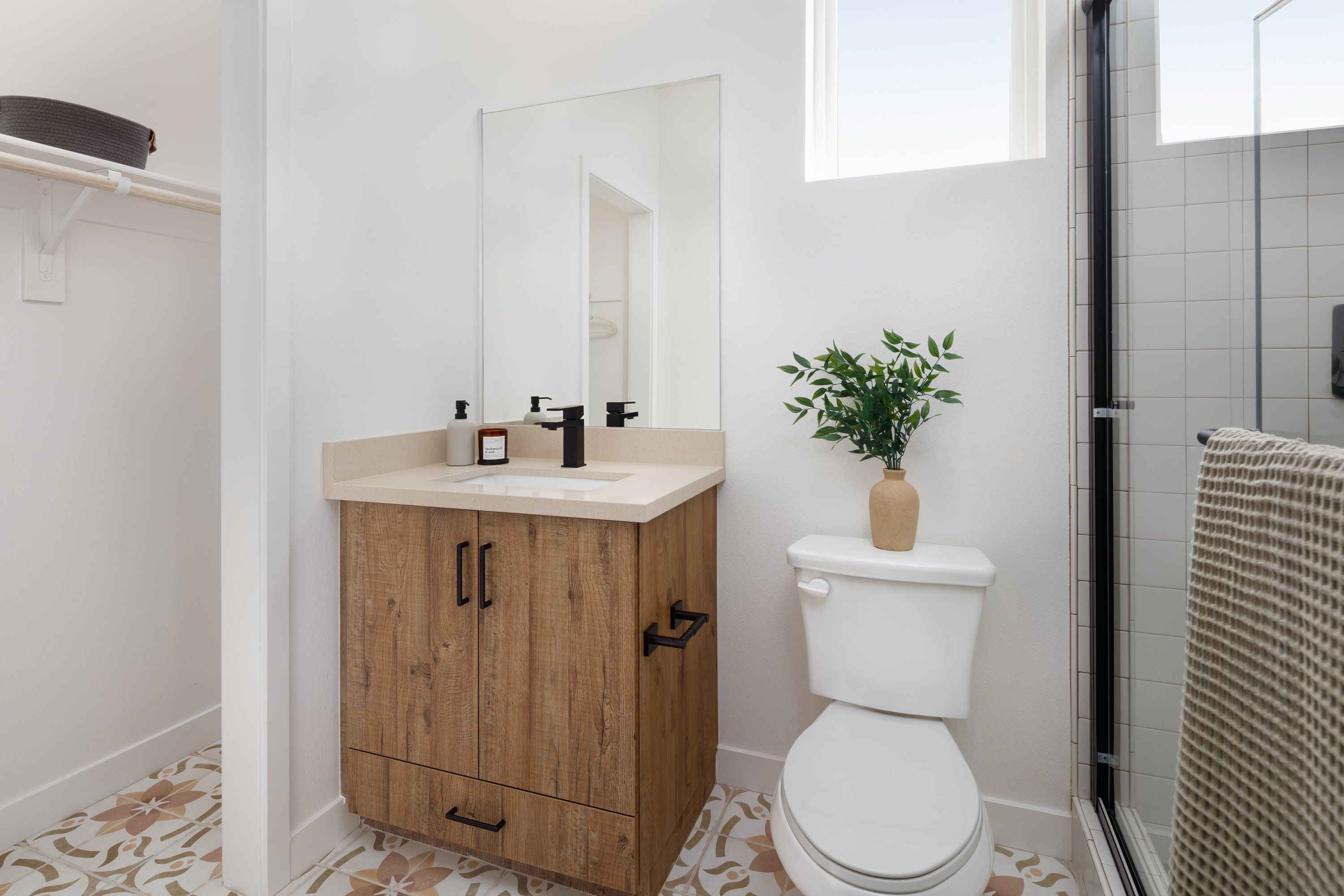 Model home first-floor full bathroom with a functional vanity and shower.