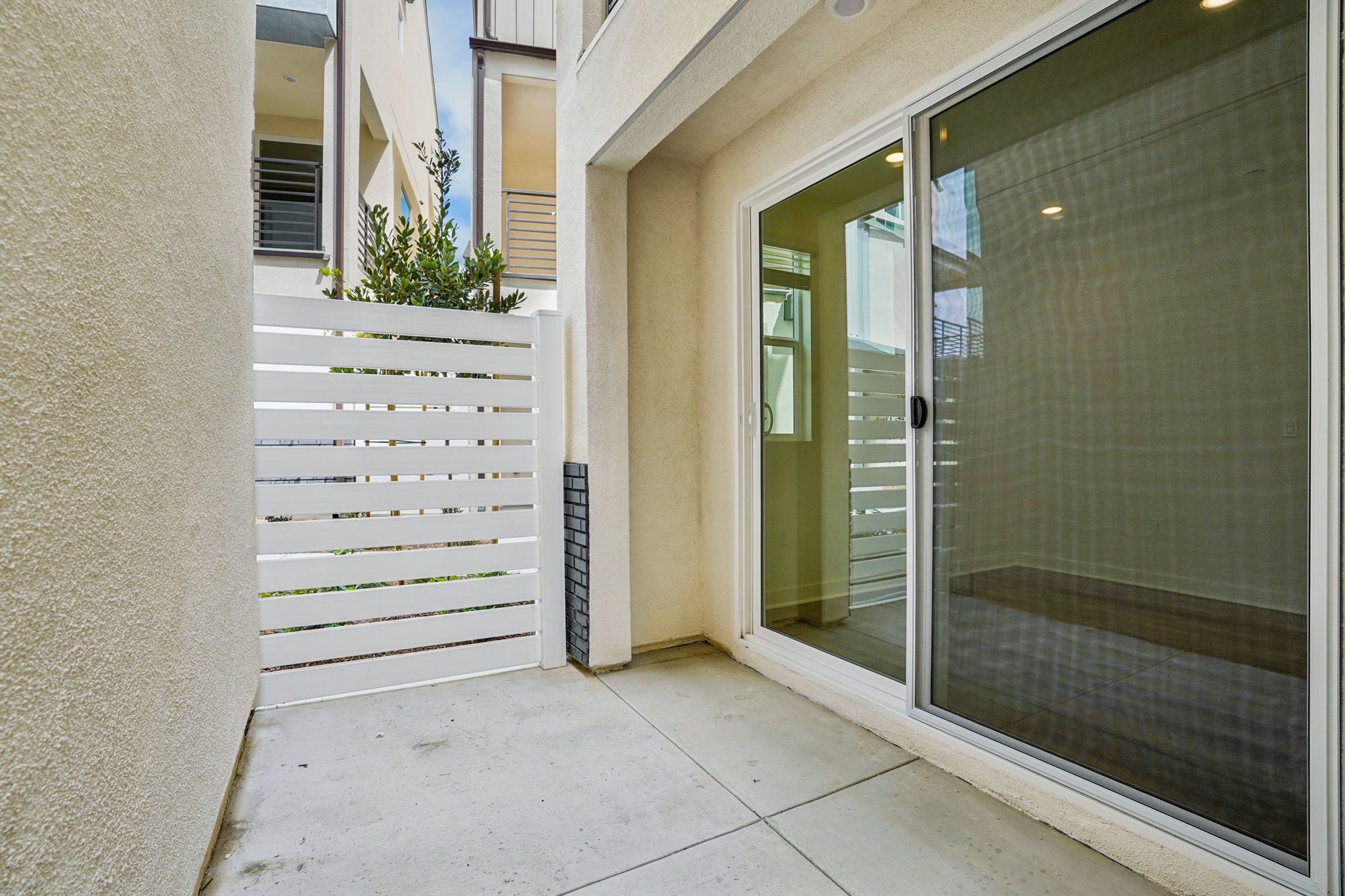 Outdoor space connected to junior primary suite by a sliding door