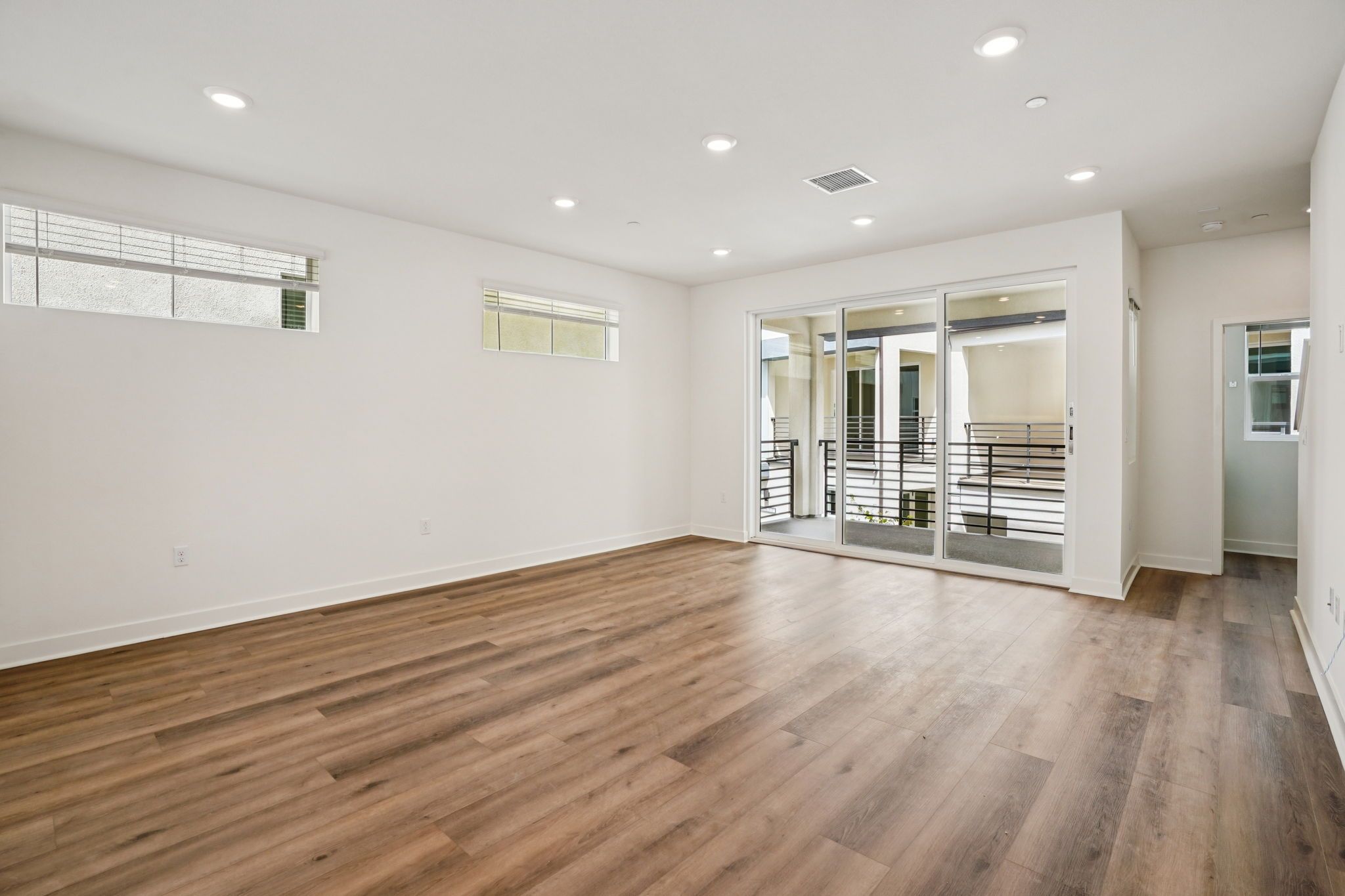 Great room featuring an open layout for kitchen, dining, and living.