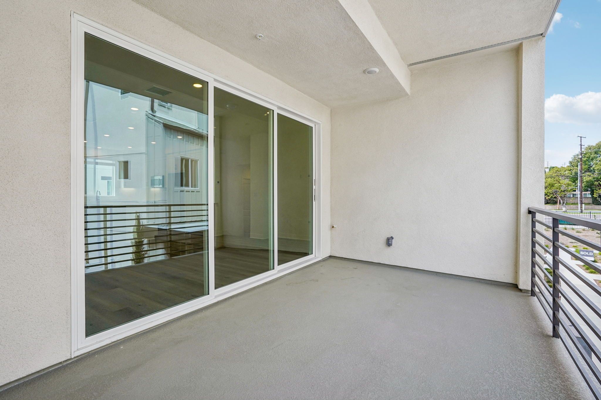 Spacious deck with 3 panel multi-sliding glass doors