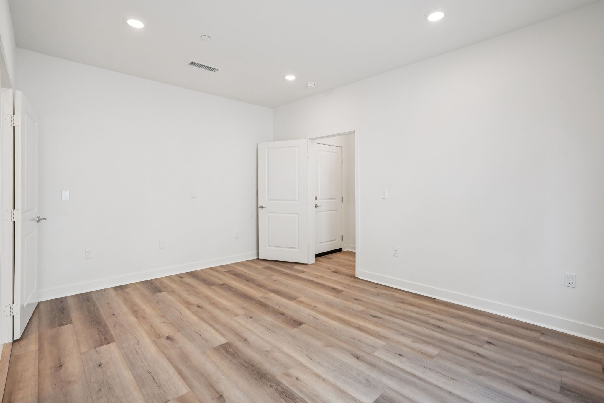 First-floor junior primary suite with upgraded flooring