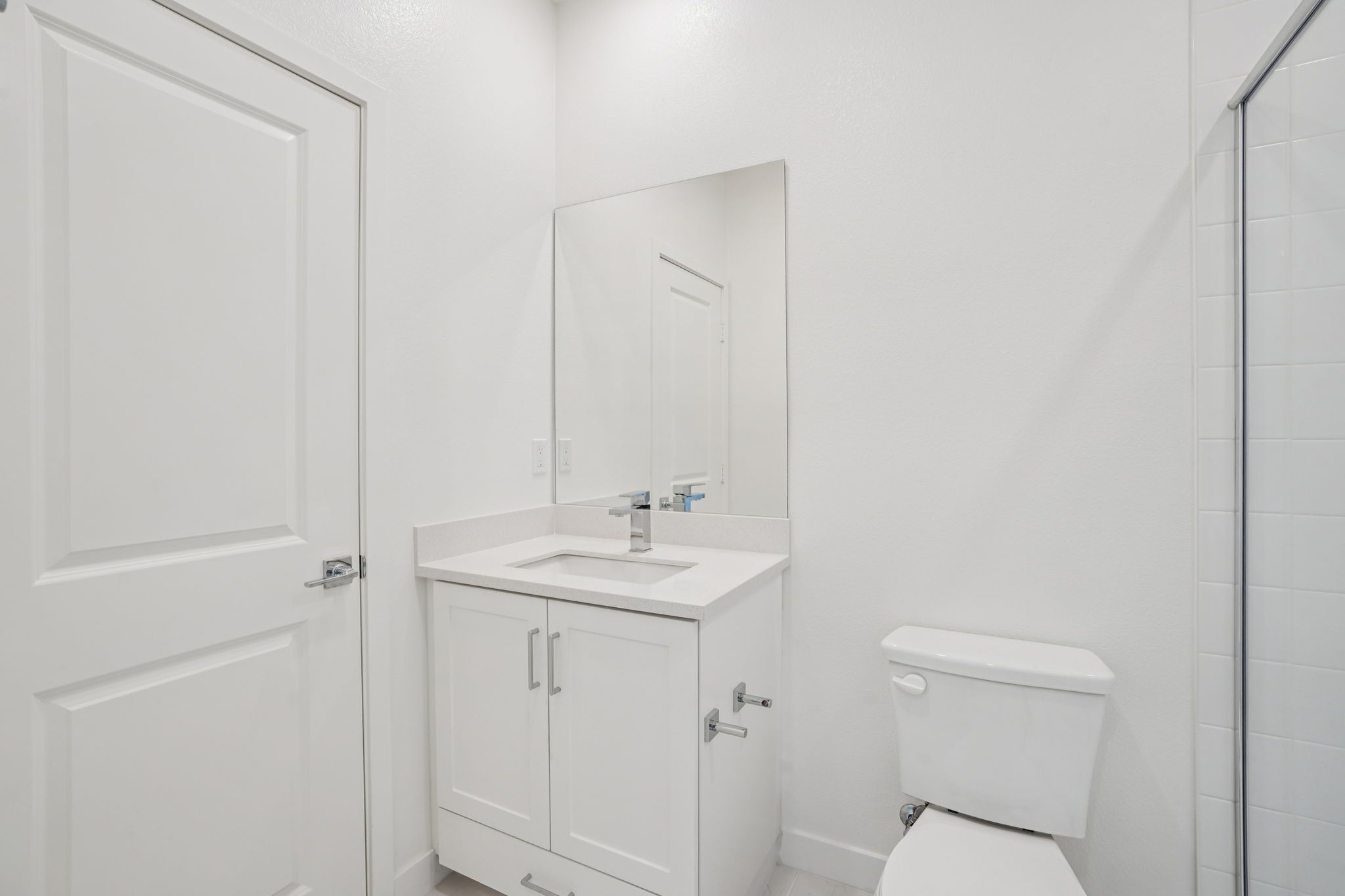 Convenient first-floor full bathroom with vanity and shower.
