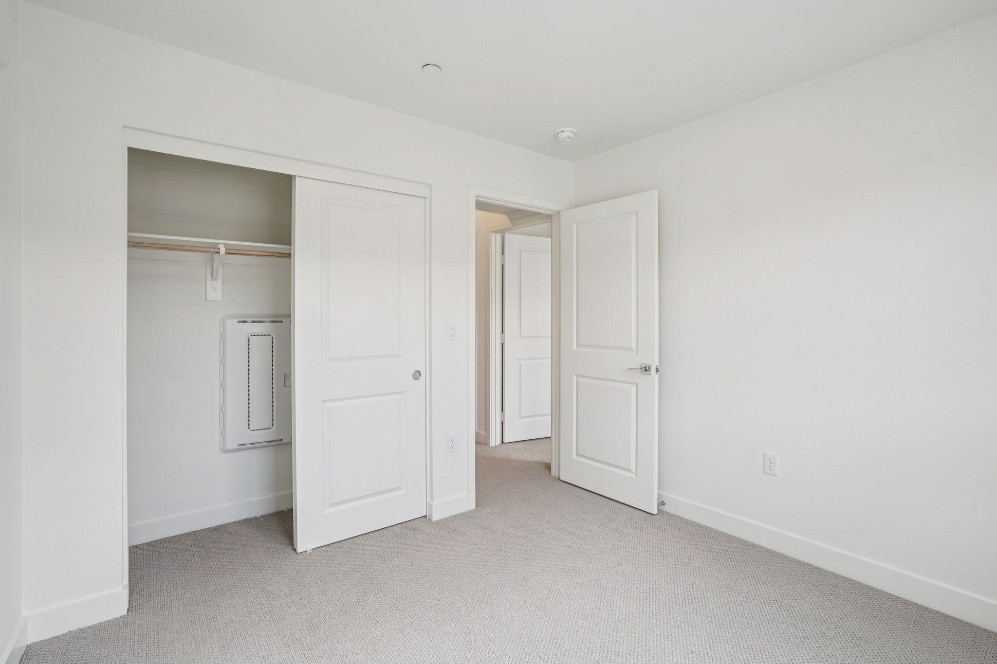 Secondary bedroom 2 with upgraded flooring and closet