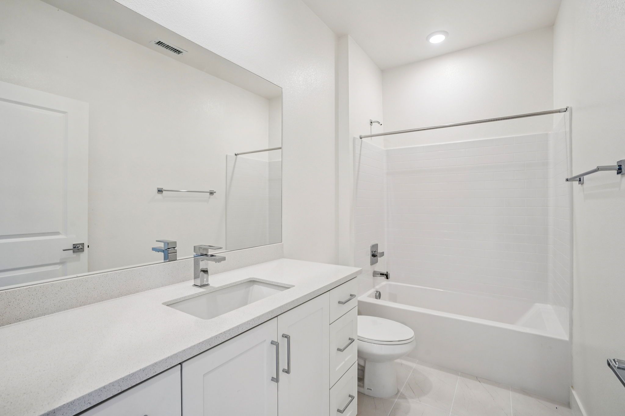 Convenient full bathroom with vanity and shower