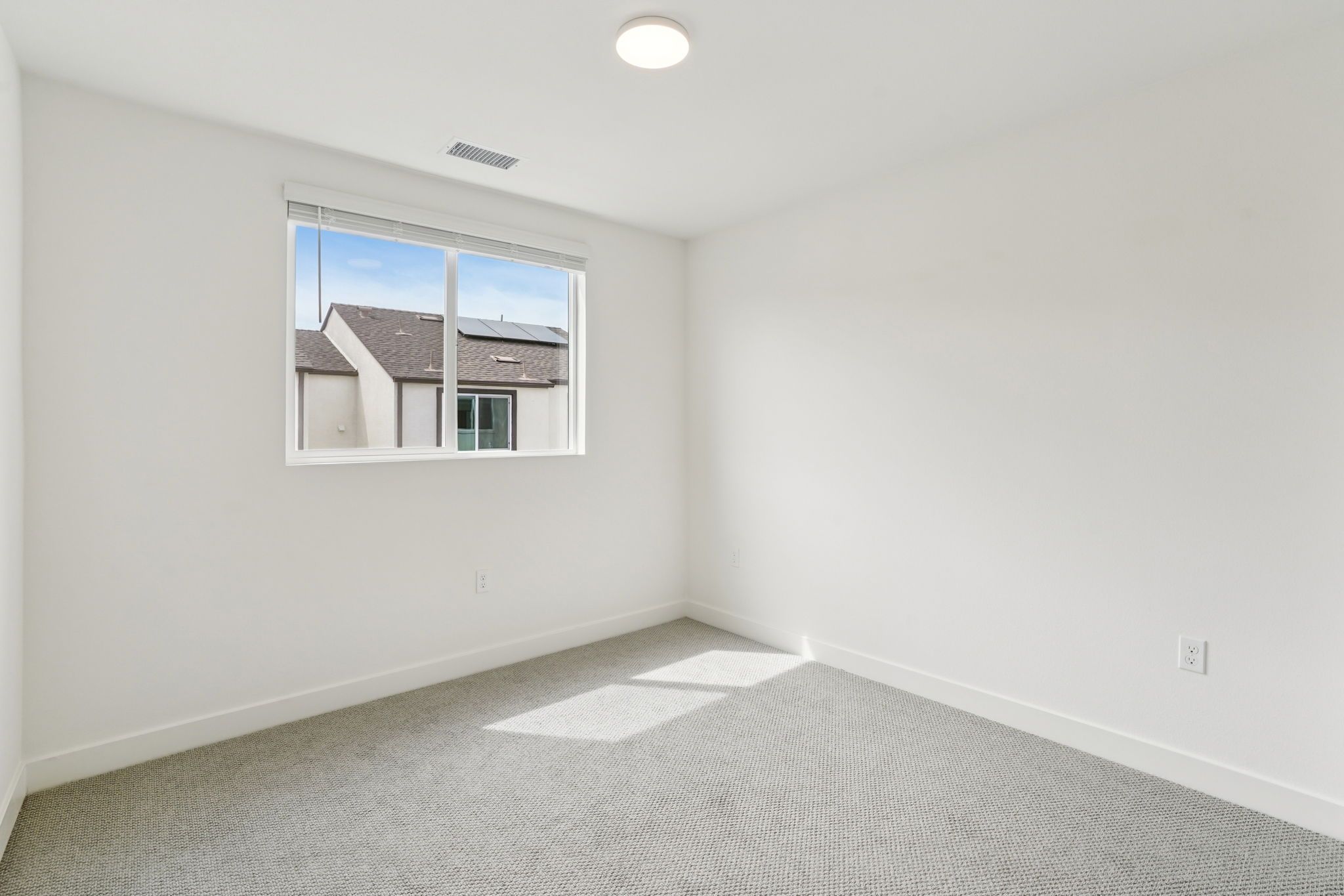 Well-proportioned secondary bedroom 3 with a large window and balanced design