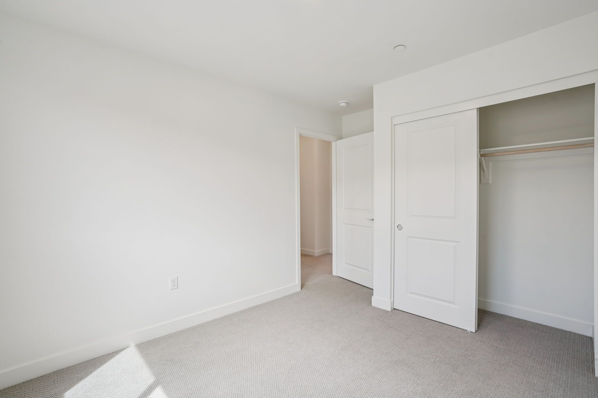 Secondary bedroom 3 with upgraded flooring and closet