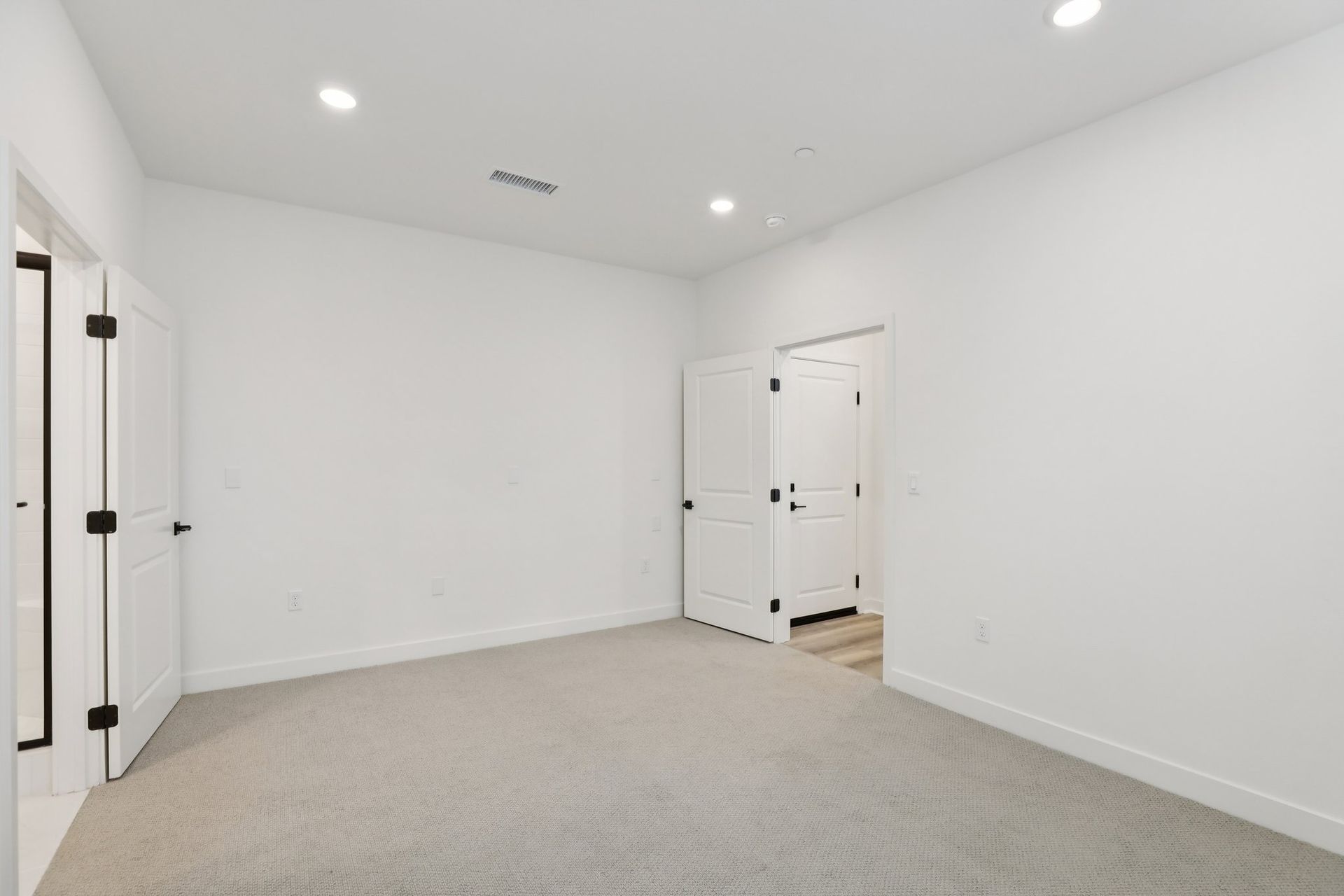 First-floor junior primary suite with upgraded flooring