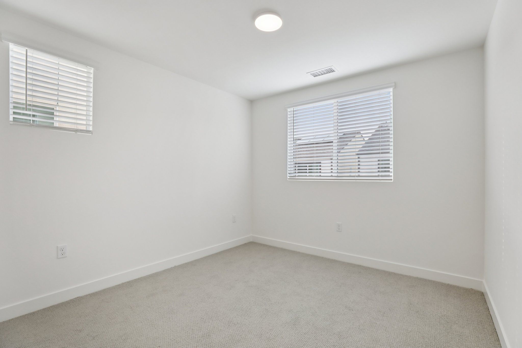 Well-proportioned secondary bedroom 3 with a large window and balanced design