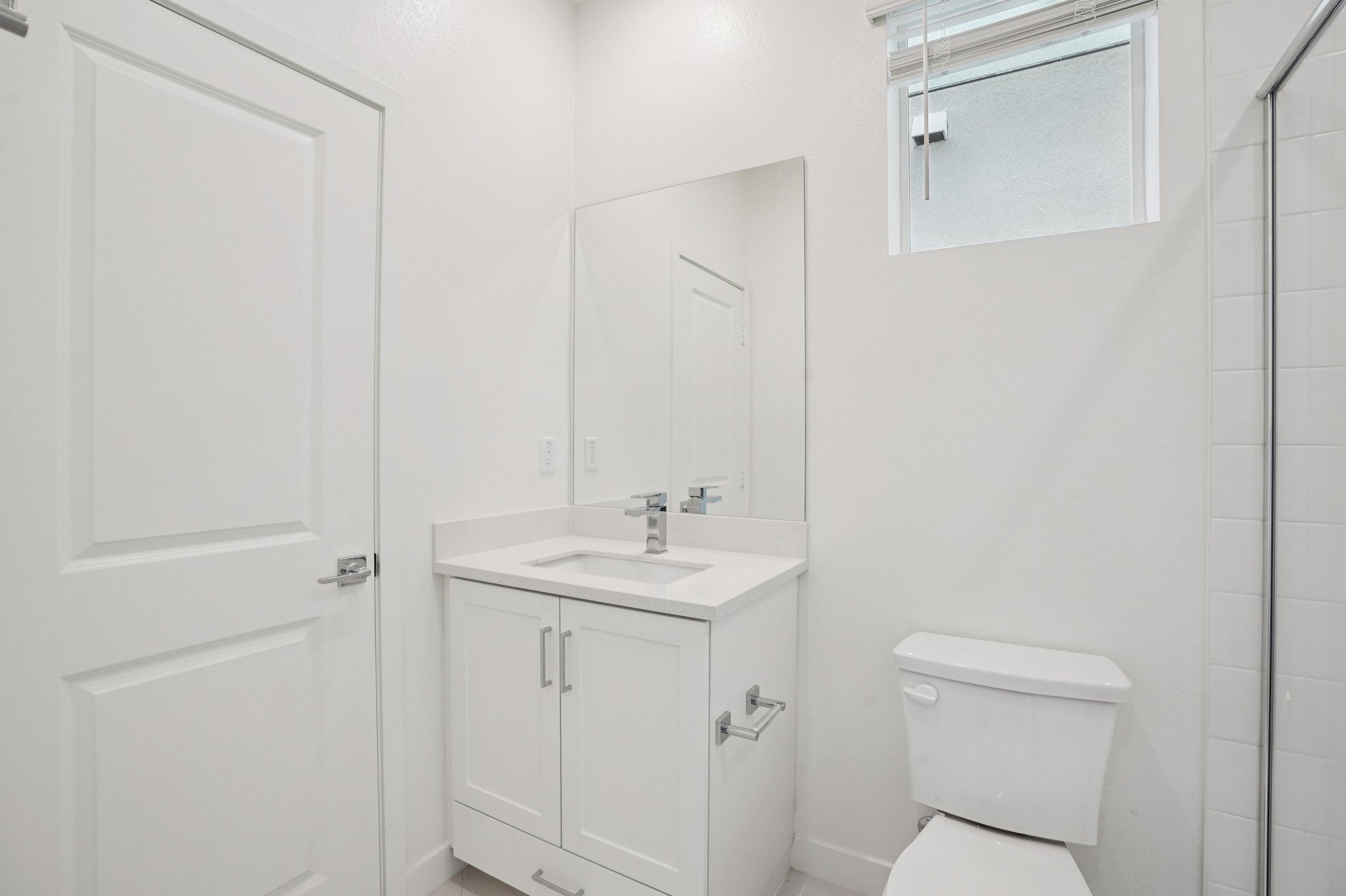 Convenient first-floor full bathroom with vanity and shower.