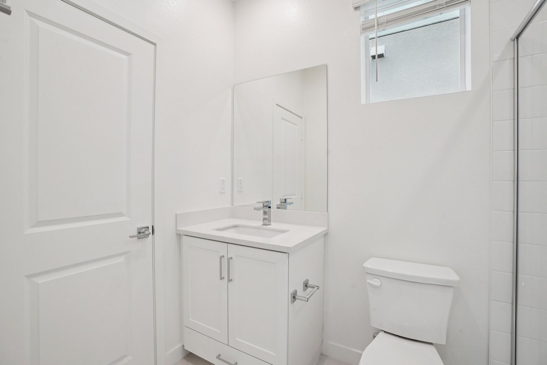 Convenient first-floor full bathroom with vanity and shower.