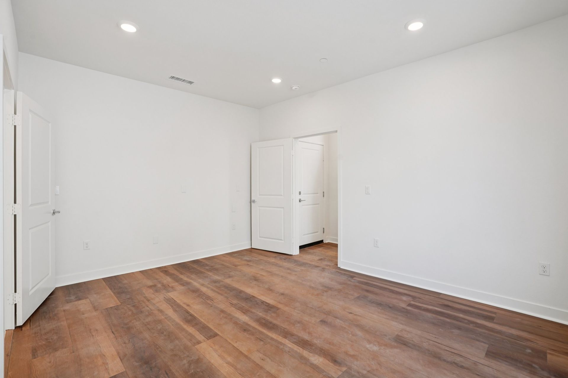 First-floor junior primary suite with upgraded flooring