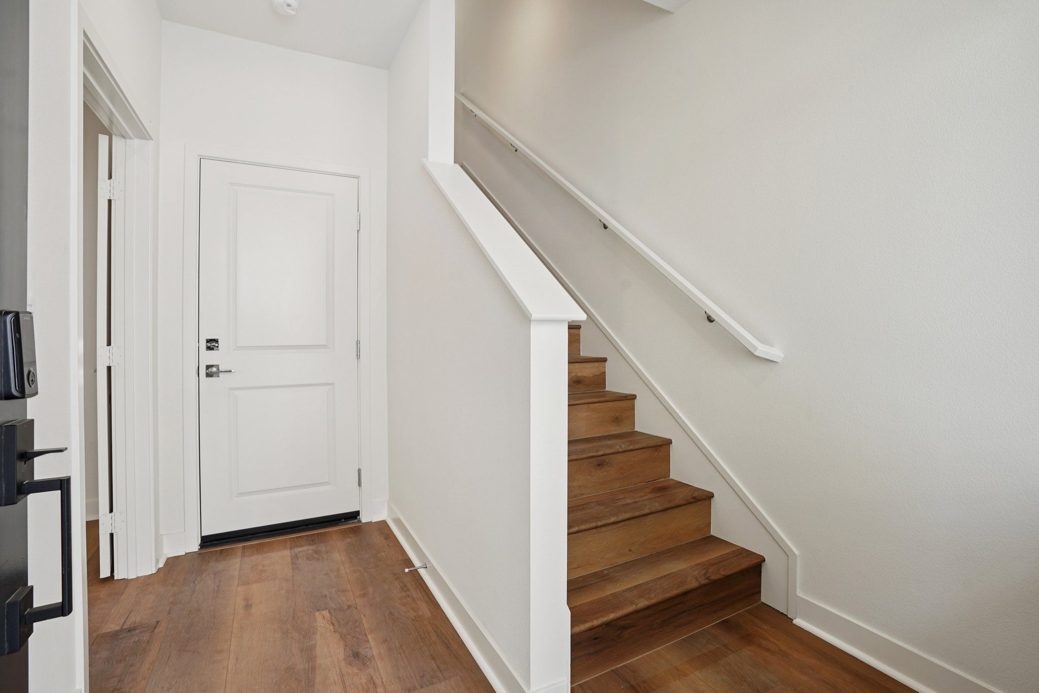 Entry stair case with upgraded flooring throughout 